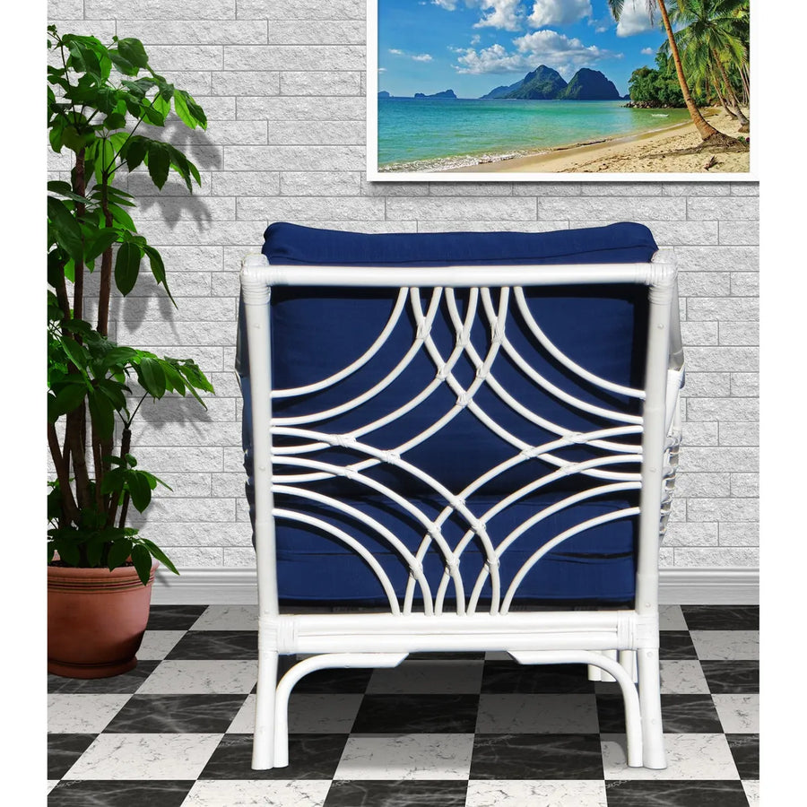 Back of the Bali arm chair in White, with overlapping rattan arcs over a navy back cushion