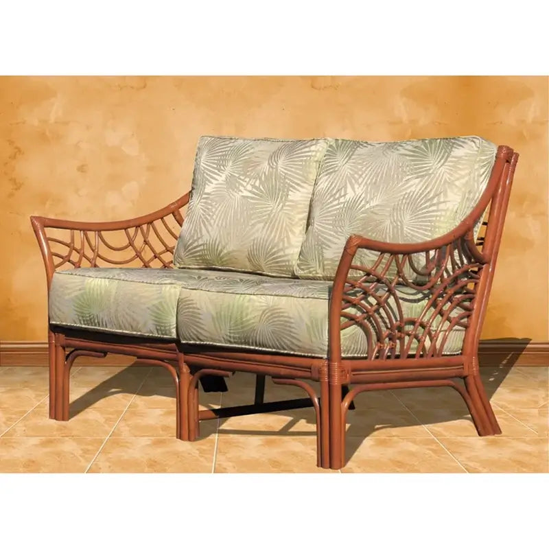 Bali loveseat in Brownwash with pale green palm print seat and back cushions, angled view