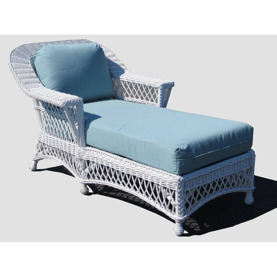 White wicker chaise from the Bar Harbor collection with a solid light blue cushion and back pillow