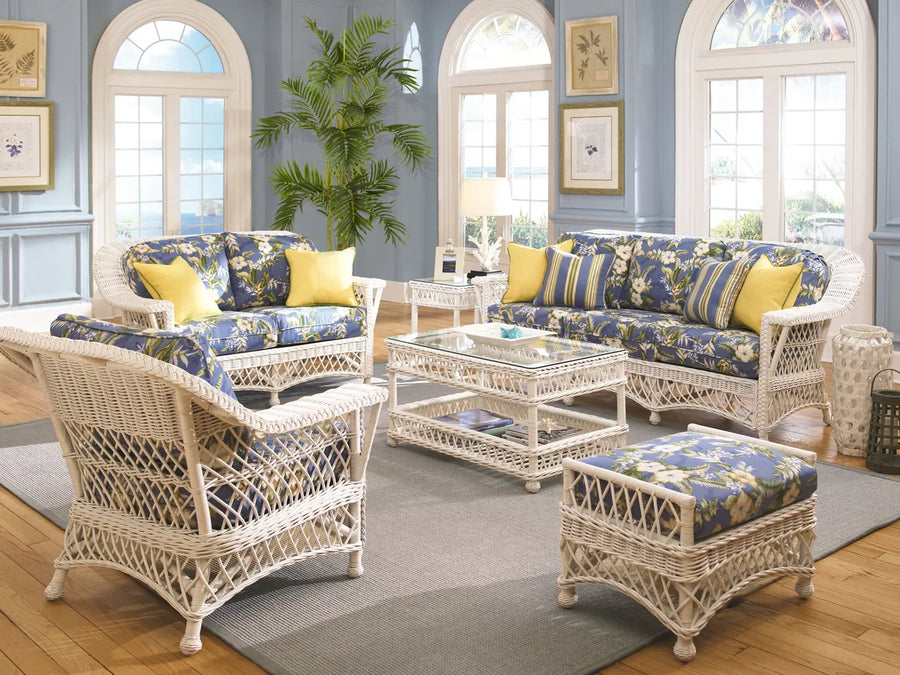 Bar Harbor seating in White with blue and yellow floral cushions in a bright living room