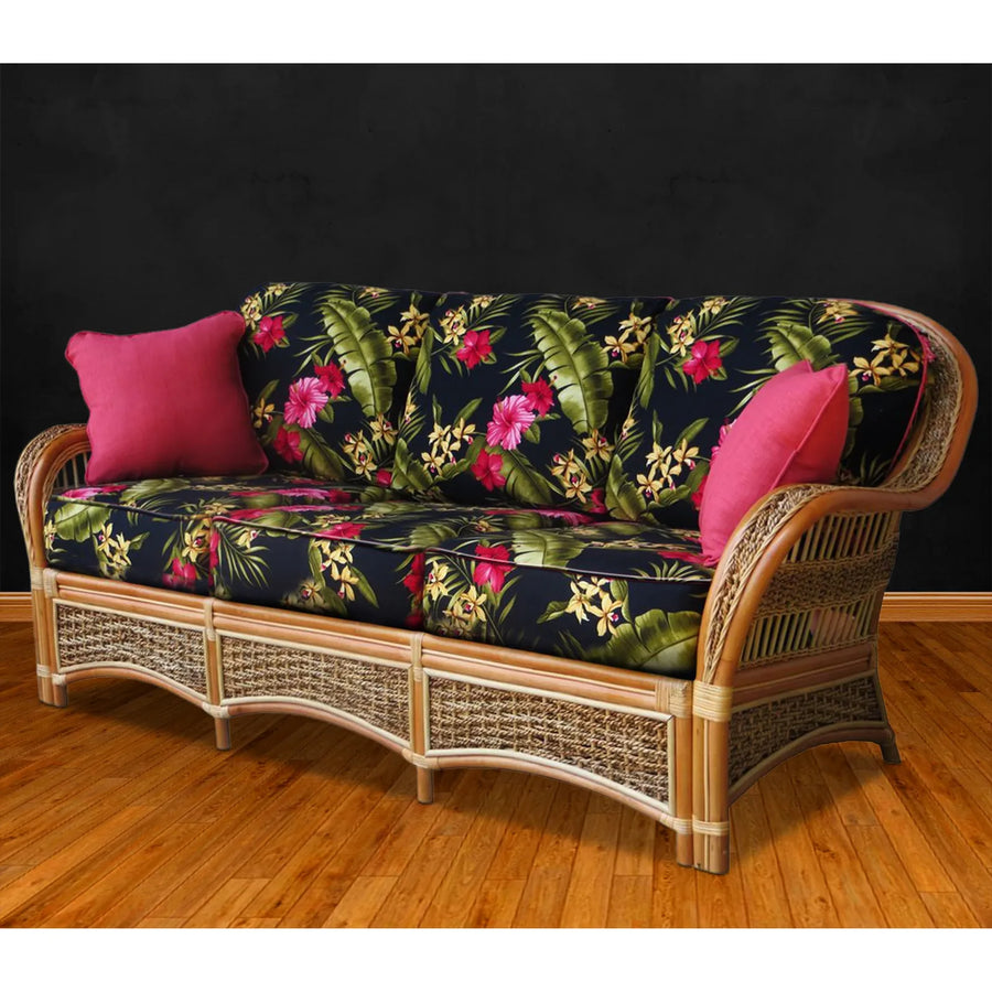 Spice Island sofa in Natural with black hibiscus print cushions and pink throw pillows