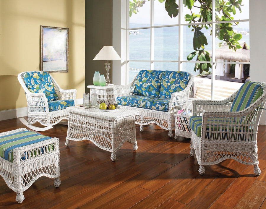 Naples living room in White with a coffee table, loveseat, rocker, arm chair and ottoman by a sunny window