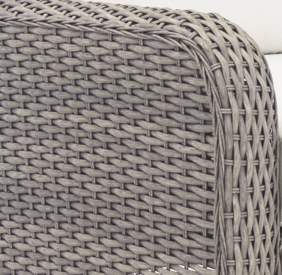 Stone resin wicker weave, close view of a rolled St. Tropez arm