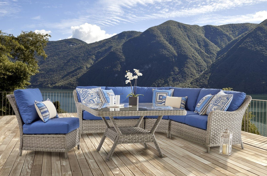 Mayfair sectional and armless chair with royal blue cushions on a deck with mountain views
