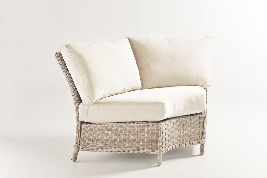 Mayfair sectional wedge corner in Pebble wicker with a cream seat and two back cushions