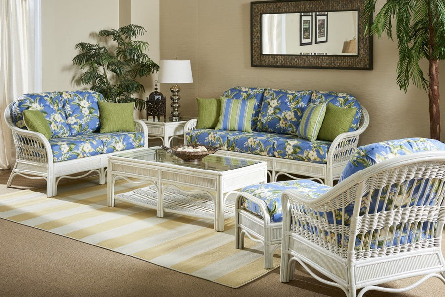 Whitewash Bermuda living room with blue floral cushions, green pillows and a yellow striped rug