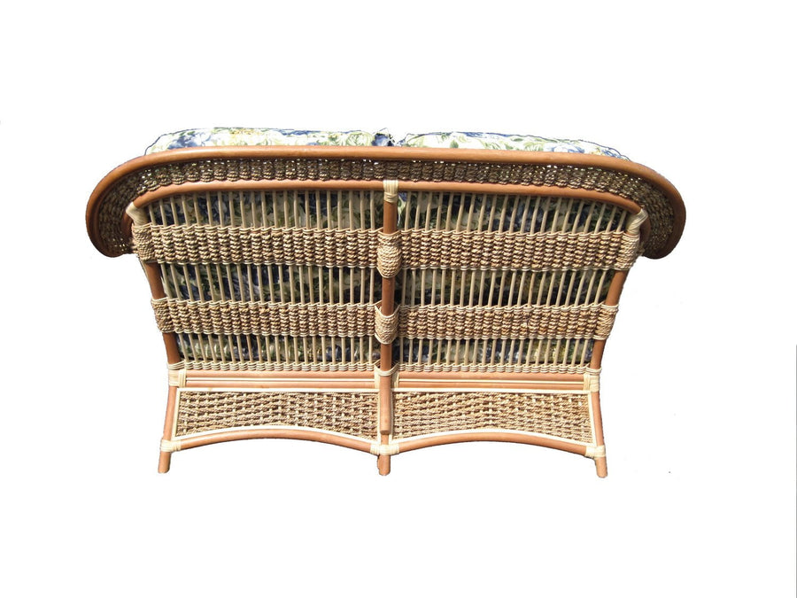 Islander loveseat in Natural seen from behind, showing the curved top rail and woven base