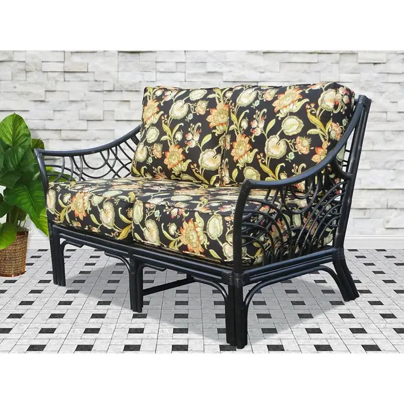 Bali loveseat in Black with black floral cushions in orange and gold