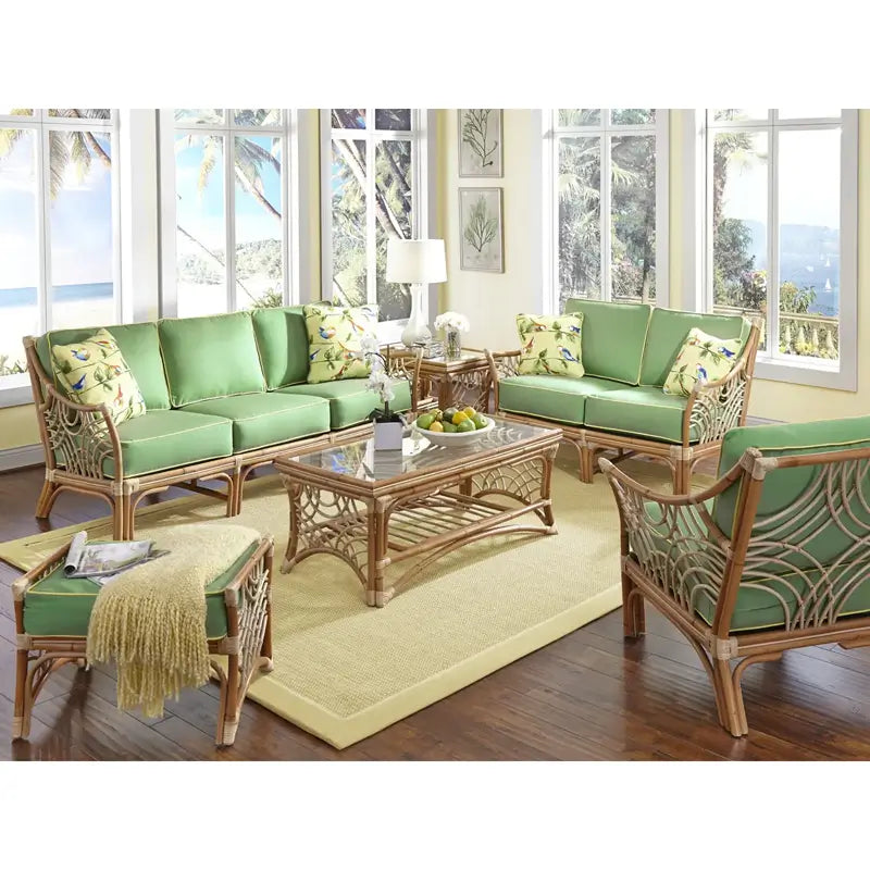 Bali seating in Natural with lime green cushions and a glass top coffee table in a sunny room