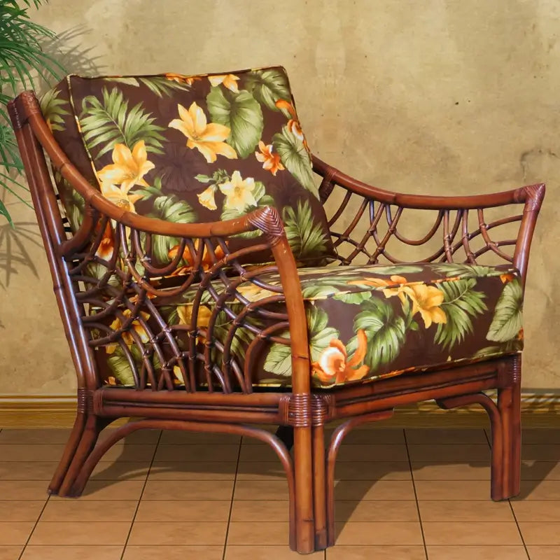 Bali wicker accent chair in Brownwash with dark brown and gold tropical floral cushions