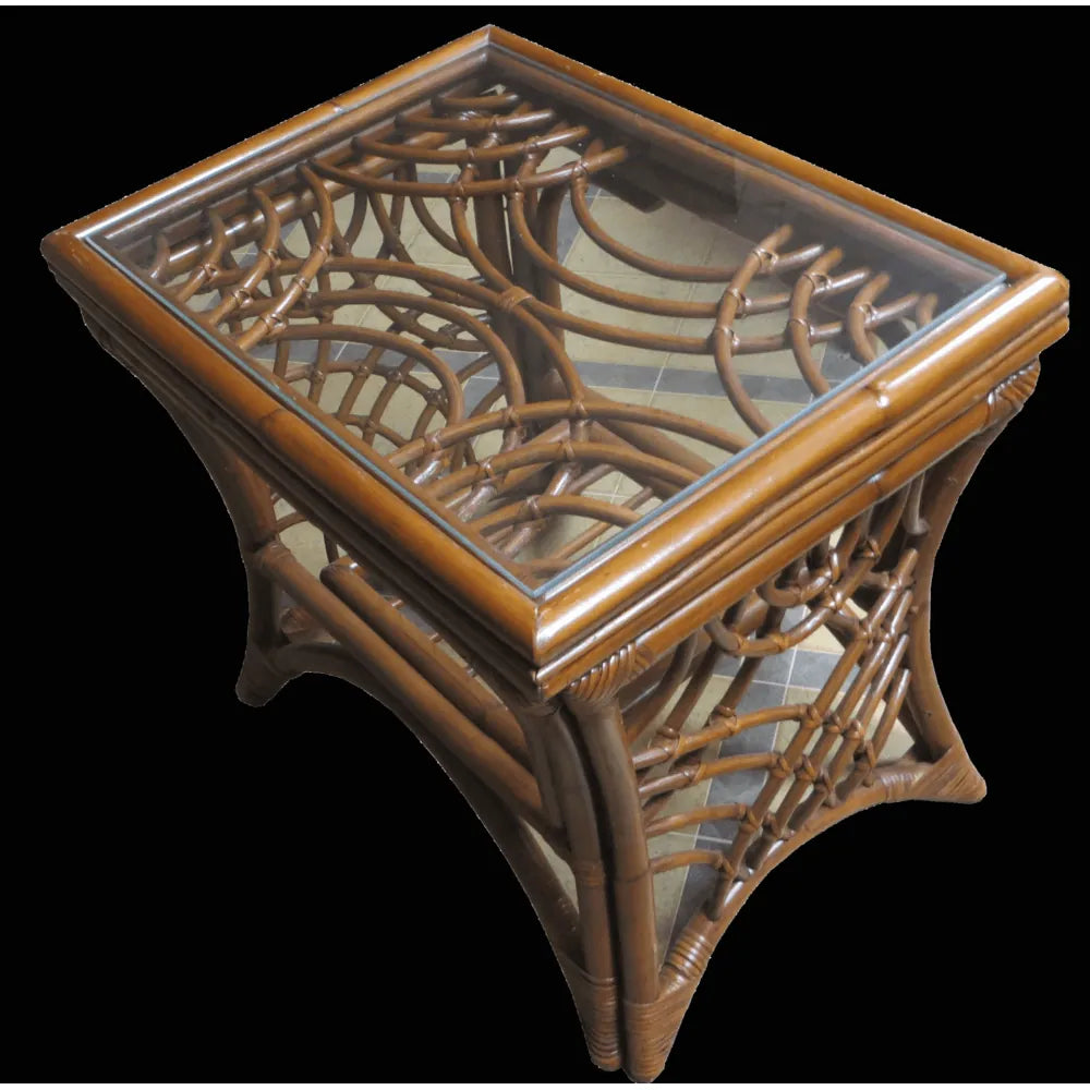 Bali black rattan end table with a glass top, curved rattan fretwork and a slatted lower shelf