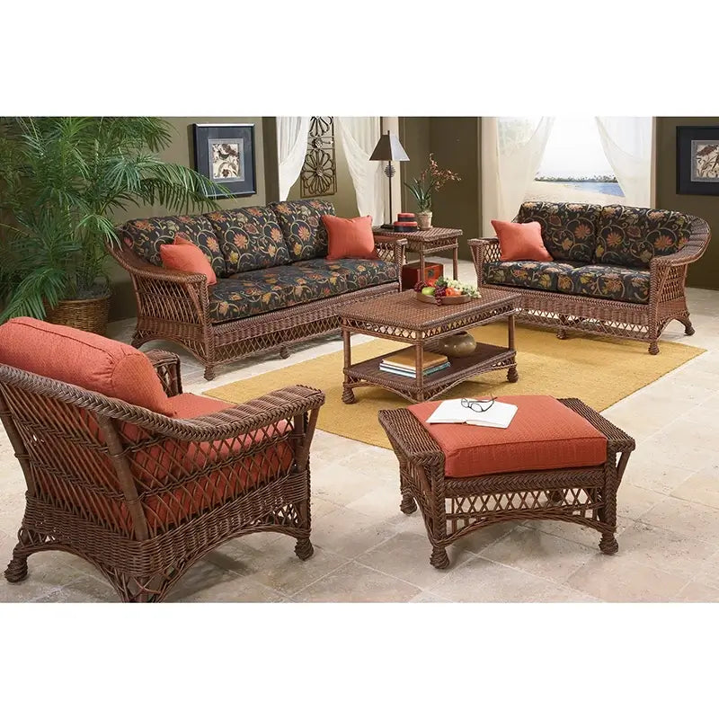 Bar Harbor Sofa in Coffee finish with floral cushions, shown in a living room set with matching piece
