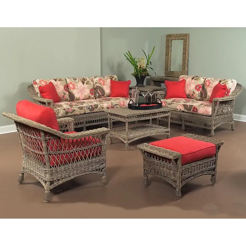 Bar Harbor Sofa in Weathered Grey finish with floral cushions and red accent pillows