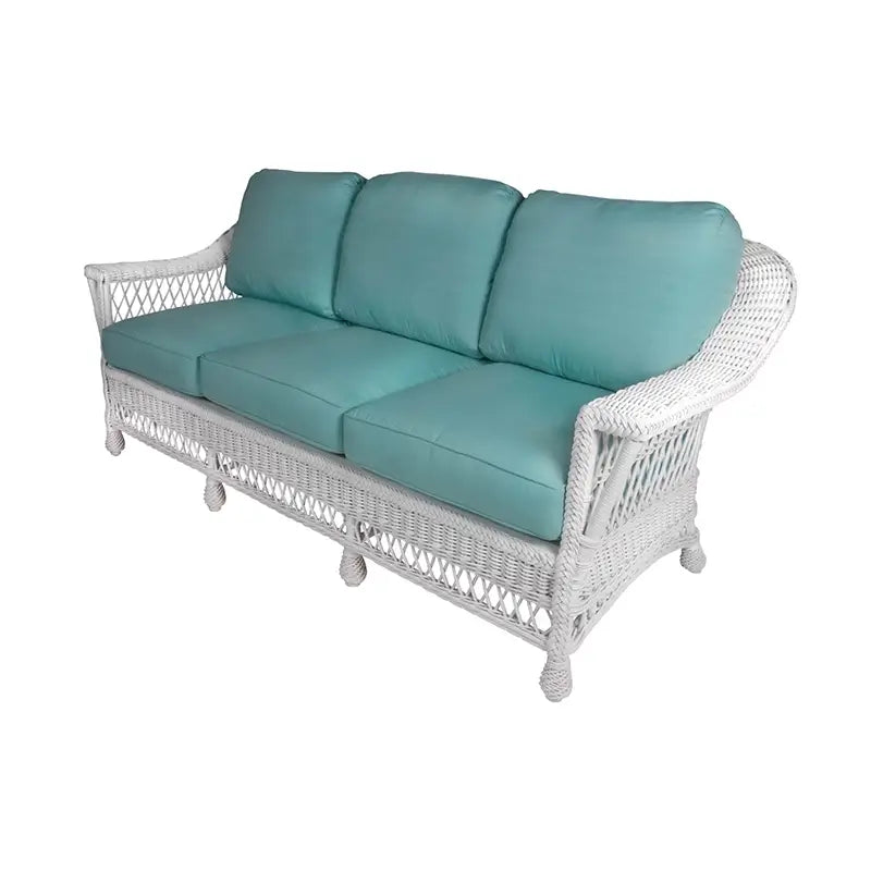 Bar Harbor Sofa in Coffee finish with bird-print cushions and coral, teal accent pillows