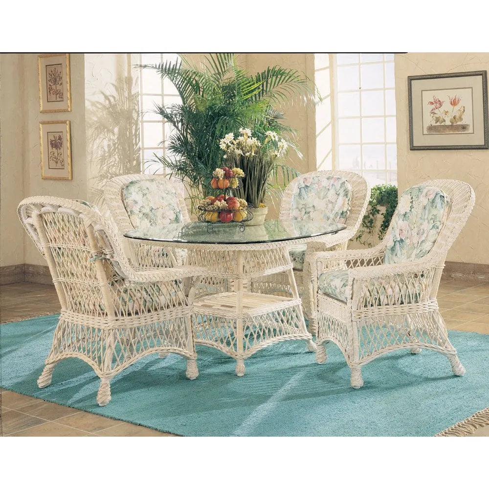 Bar Harbor white wicker dining set with a round glass table and four dining arm chairs with blue floral cushions