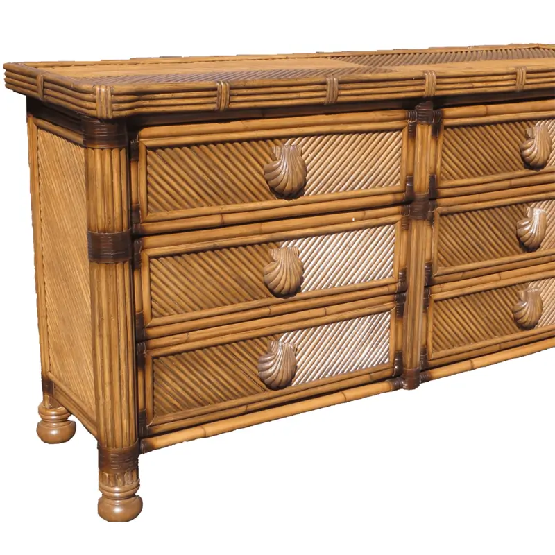 Corner close-up of the Antique Brownwash Coral Cove dresser showing the woven top, wrapped joints and turned bun feet