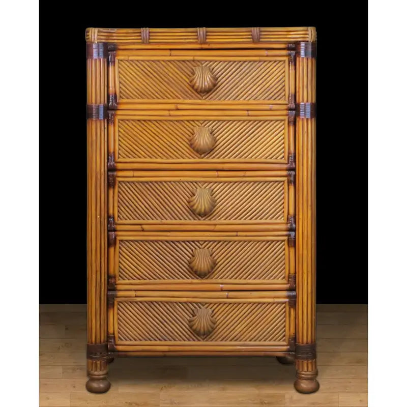 Front of an Antique Brownwash rattan dresser with diagonal-patterned drawer fronts and carved shell pulls