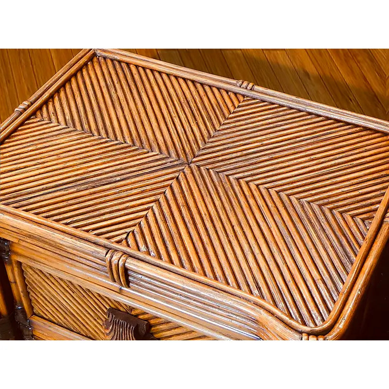 Close-up of the antique brownwash night stand top, woven in a diagonal diamond pattern inside a pole frame