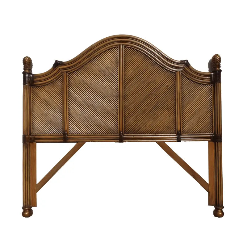 Antique Brownwash queen headboard with an arched crown, woven panels, pineapple finials and bun feet