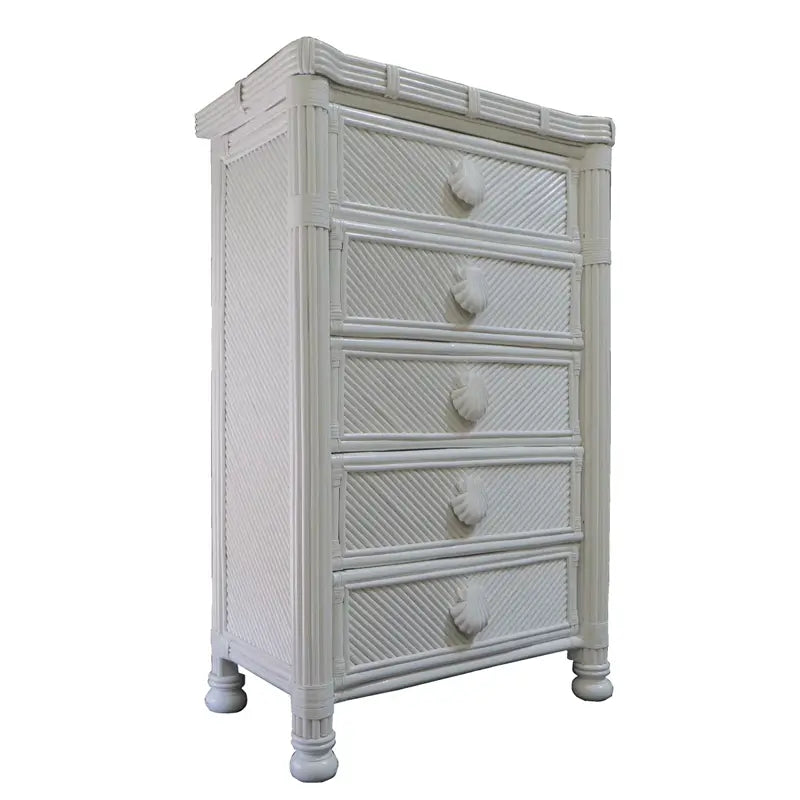 White Coral Cove woven rattan dresser seen at an angle, with shell-shaped drawer pulls and turned feet