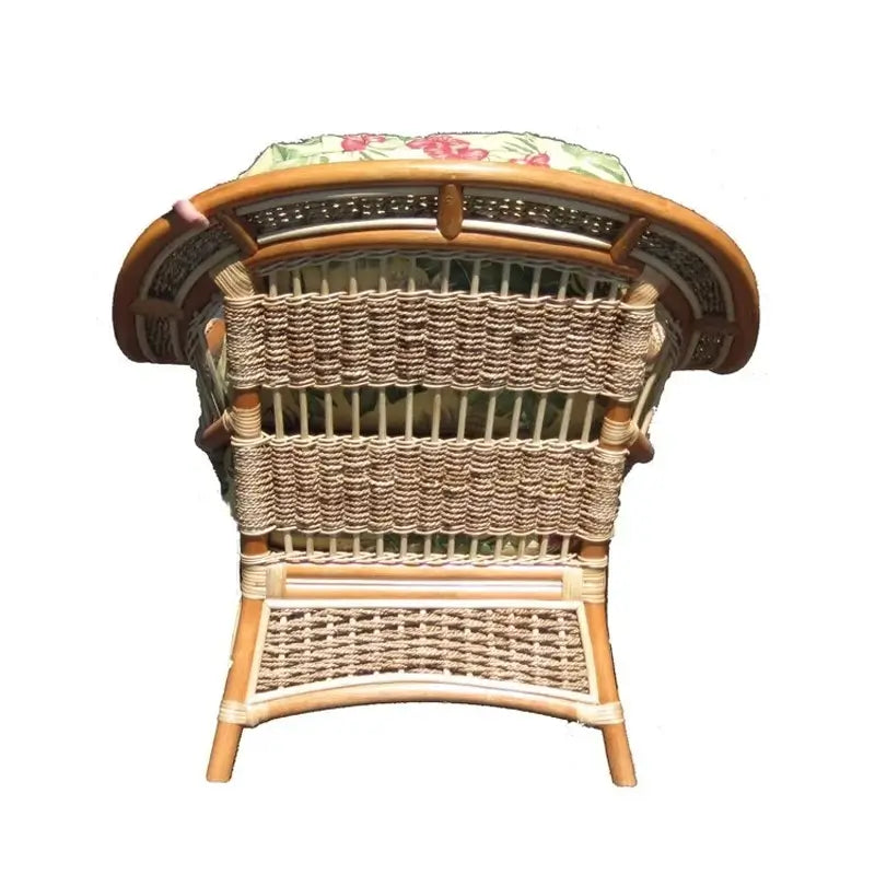 Back view of the Islander arm chair in natural finish, showing rope-woven panels on a curved rattan frame