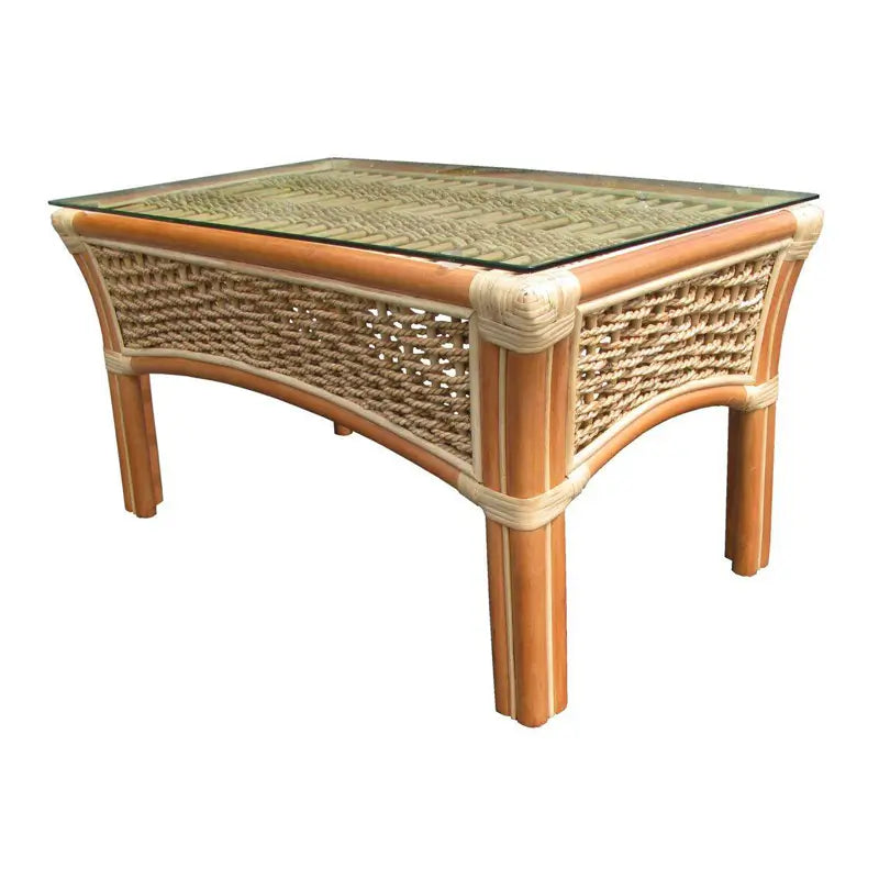 Islander small rattan coffee table in Natural from the corner, glass over a woven top, arched sides and wrapped joints