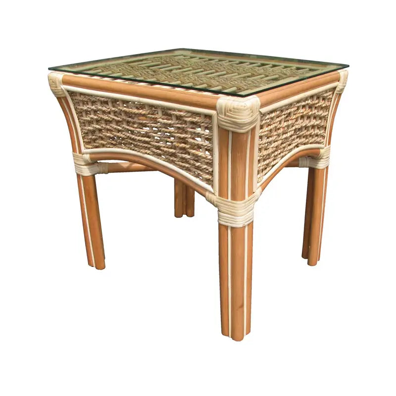 Small rattan side table in Natural, Islander line, at an angle with glass over a woven top and cream-wrapped corners
