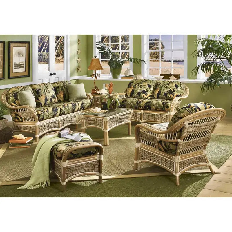 Sunroom with the Islander sofa, loveseat, arm chair, ottoman and glass-top coffee table in a dark tropical print