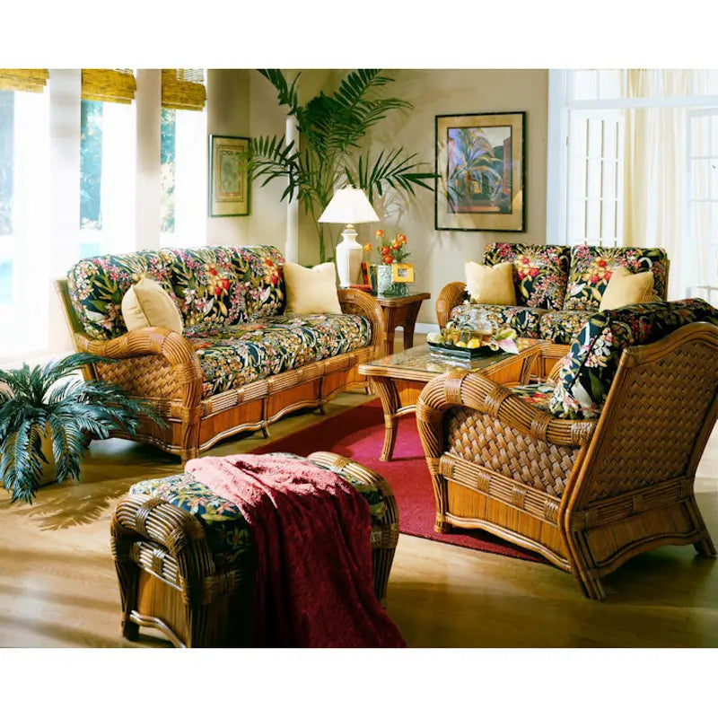 Kingston Reef dark wicker furniture set in cinnamon: sofa, loveseat, arm chair, ottoman and glass-top tables on a red rug