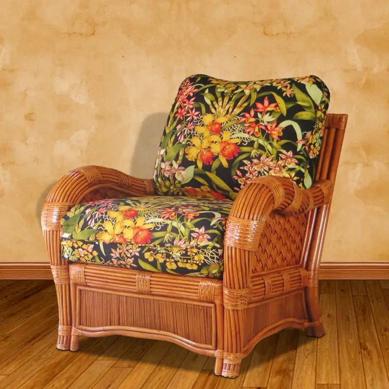Kingston Reef arm chair in cinnamon with black orchid print cushions, in front of a warm tan wall on a wood floor