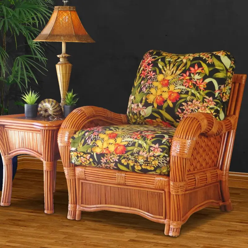 Kingston Reef arm chair in cinnamon with black orchid print cushions, beside the matching end table and a woven lamp