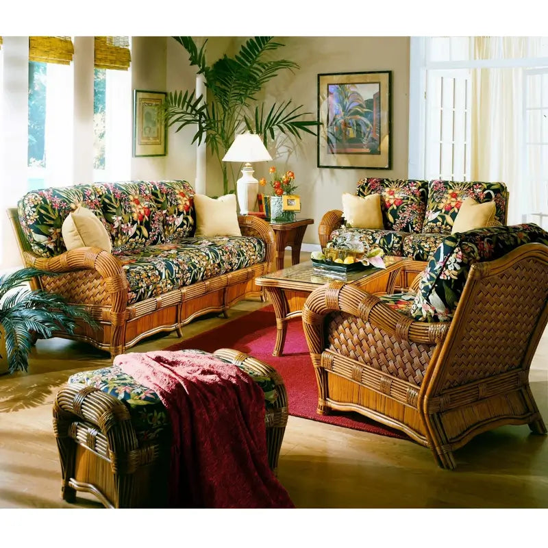 Kingston Reef living room in cinnamon with sofa, loveseat, arm chair, ottoman and glass-top coffee table on a red rug
