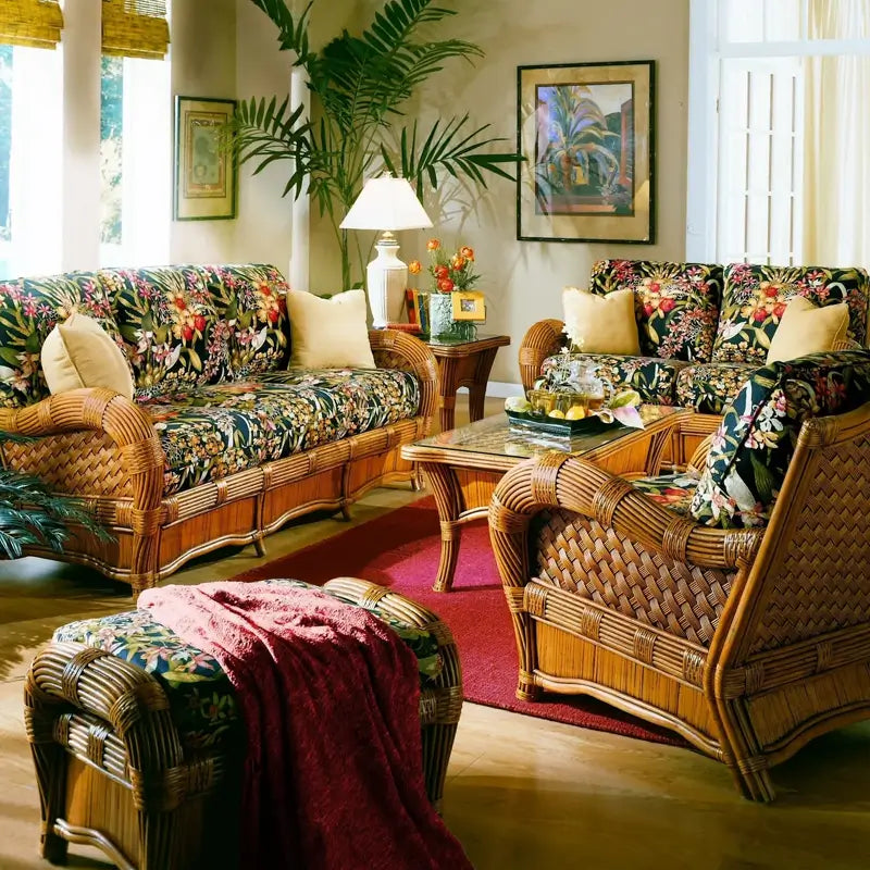 Kingston Reef cinnamon sofa beside a matching loveseat, arm chair and ottoman in a sunny room with a tall potted palm