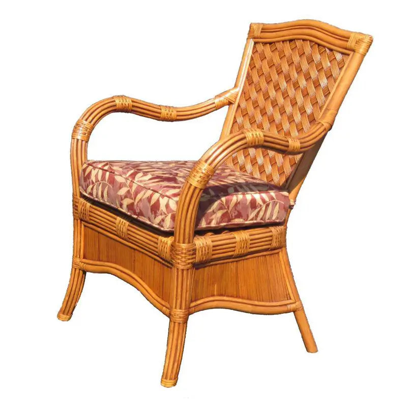 Kingston Reef dining arm chair in cinnamon, angled to show the lattice back, wrapped arms and red leaf print cushion