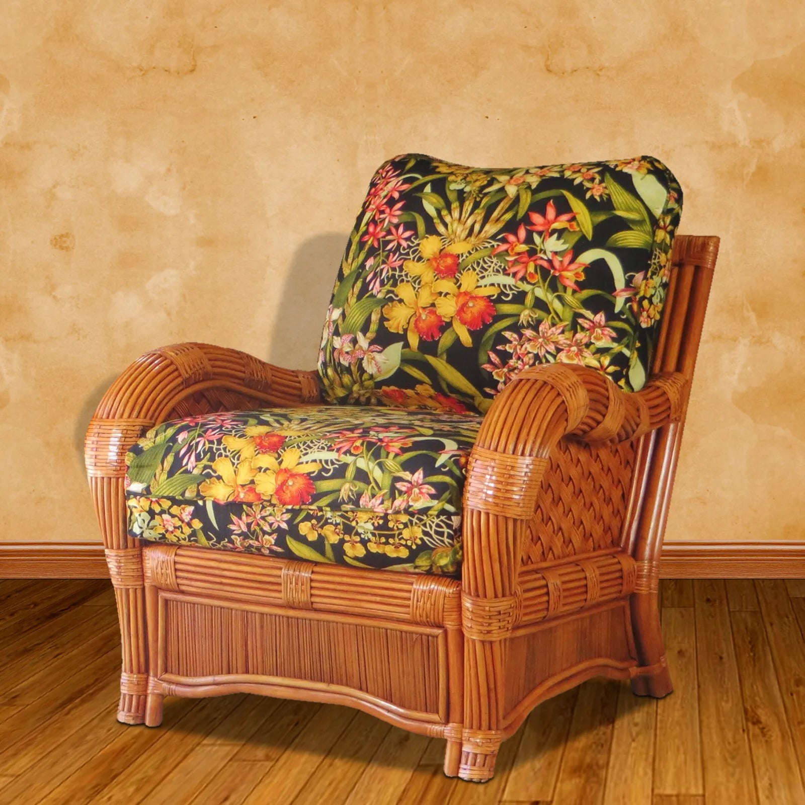Kingston Reef rattan chair with cushion in cinnamon, angled view, with black tropical floral seat and back cushions