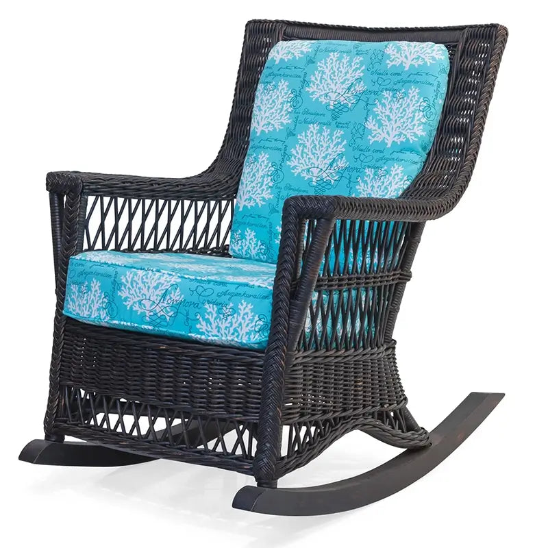 Legacy Rocker by Designer Wicker from Tribor in dark finish with teal coral-print cushions