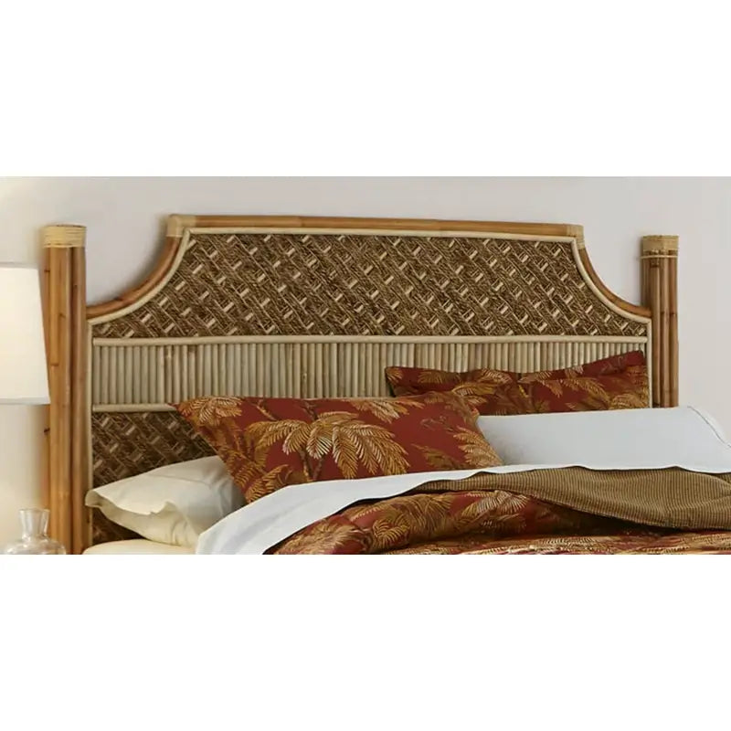 Rattan king headboard with diagonal banana bark rope weave, a band of rattan reeds and bundled rattan pole posts