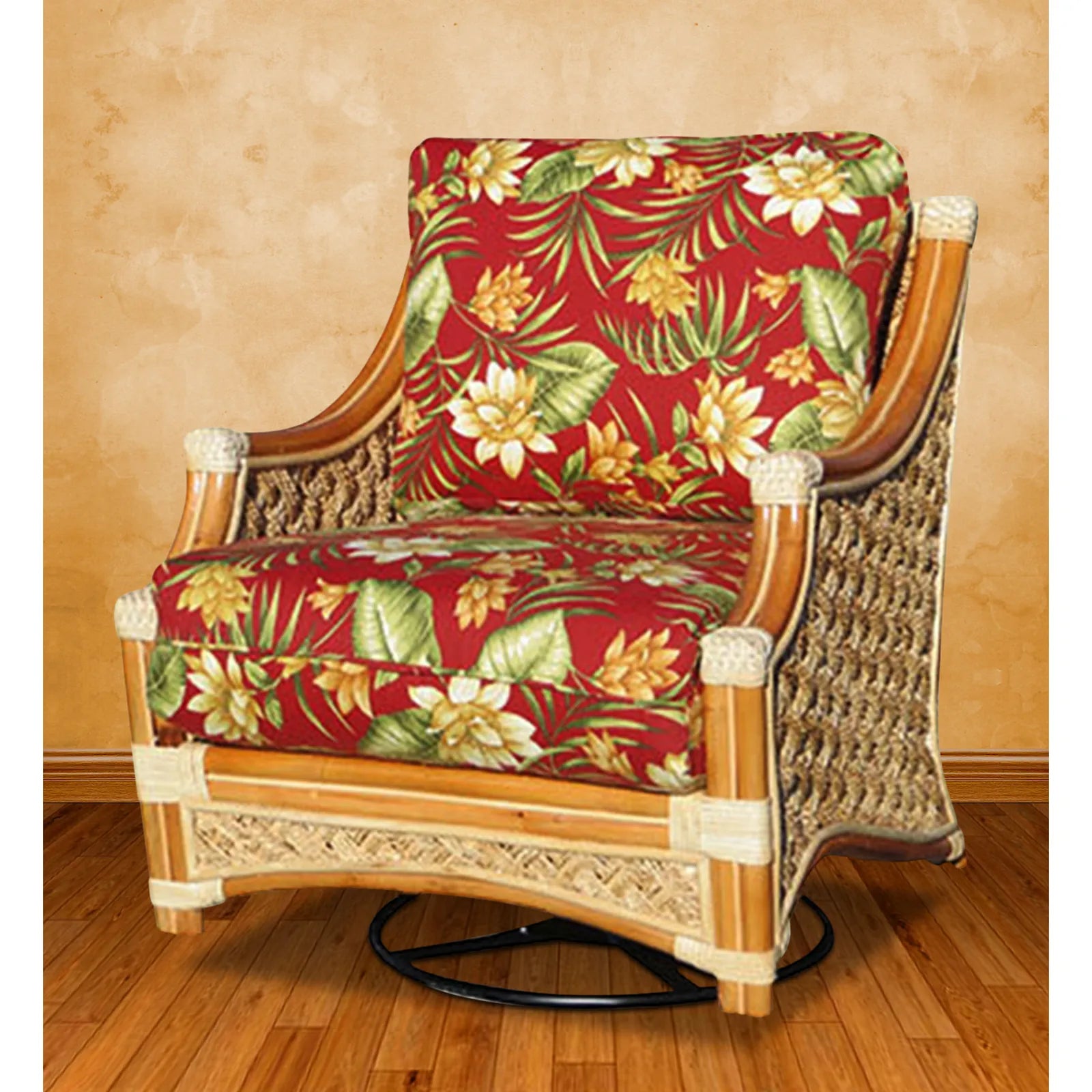 Mauna Loa rattan swivel rocker in Natural with red tropical floral cushions, angled to show the swivel base