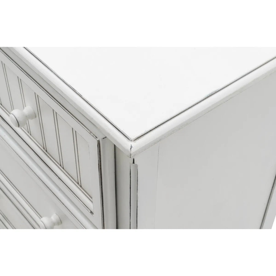 Close-up of the glazed top corner and beadboard drawer fronts on the Blanc dresser