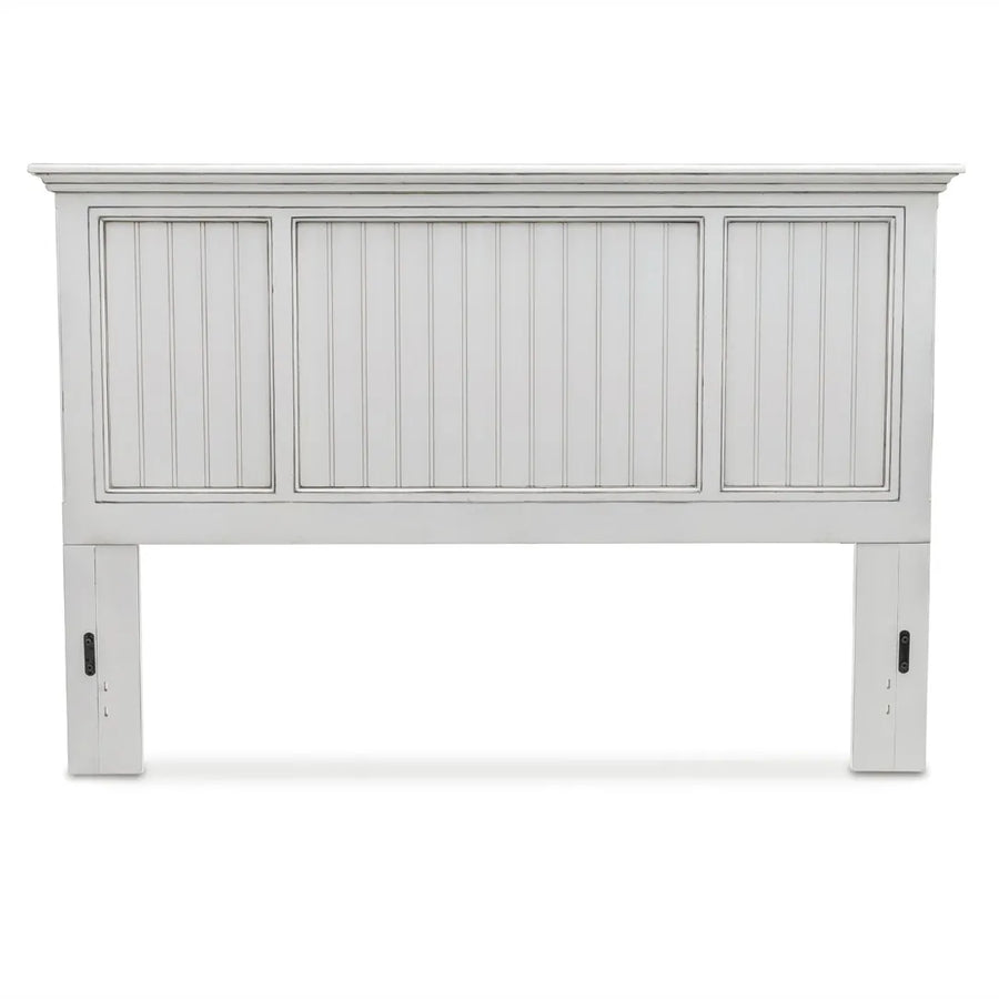Monaco king headboard in Blanc from the front, with a wide center beadboard panel between two narrower ones