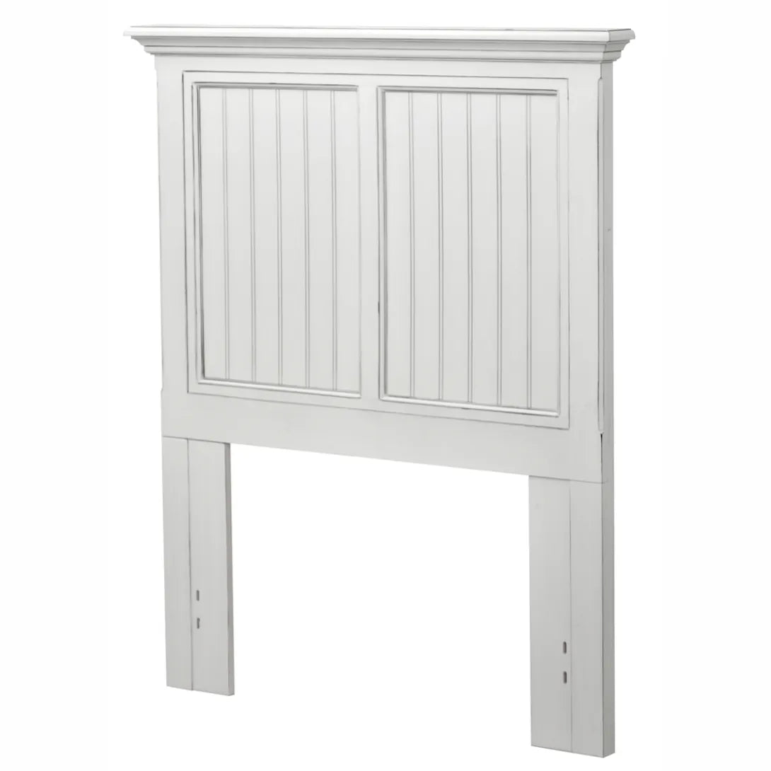 Monaco headboard in Blanc for a twin size bed, with two beadboard panels, shown at an angle