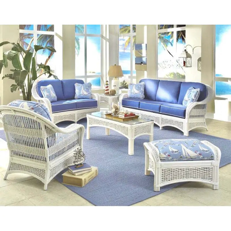 Regatta 6 piece seating set in white with royal blue sofa and loveseat cushions and a sailboat print arm chair and ottoman