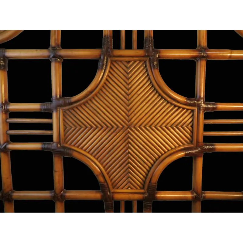 Close-up of the woven center medallion, its diagonal reeds meeting in a chevron pattern inside curved frames