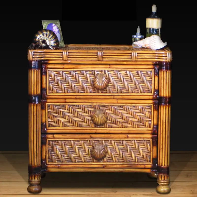Antique brownwash rattan 3 drawer dresser with diagonal woven drawer fronts, scallop shell pulls and dark-wrapped pole posts