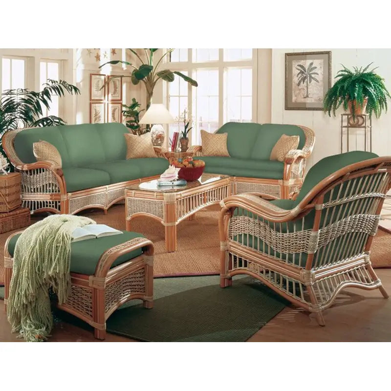 Seascape natural wicker seating set in a sunroom: sofa, loveseat, lounge chair and glass top coffee table, green cushions