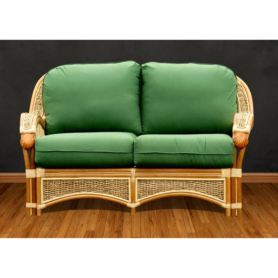 Seascape loveseat in natural wicker and honey rattan, front view with solid green seat and back cushions