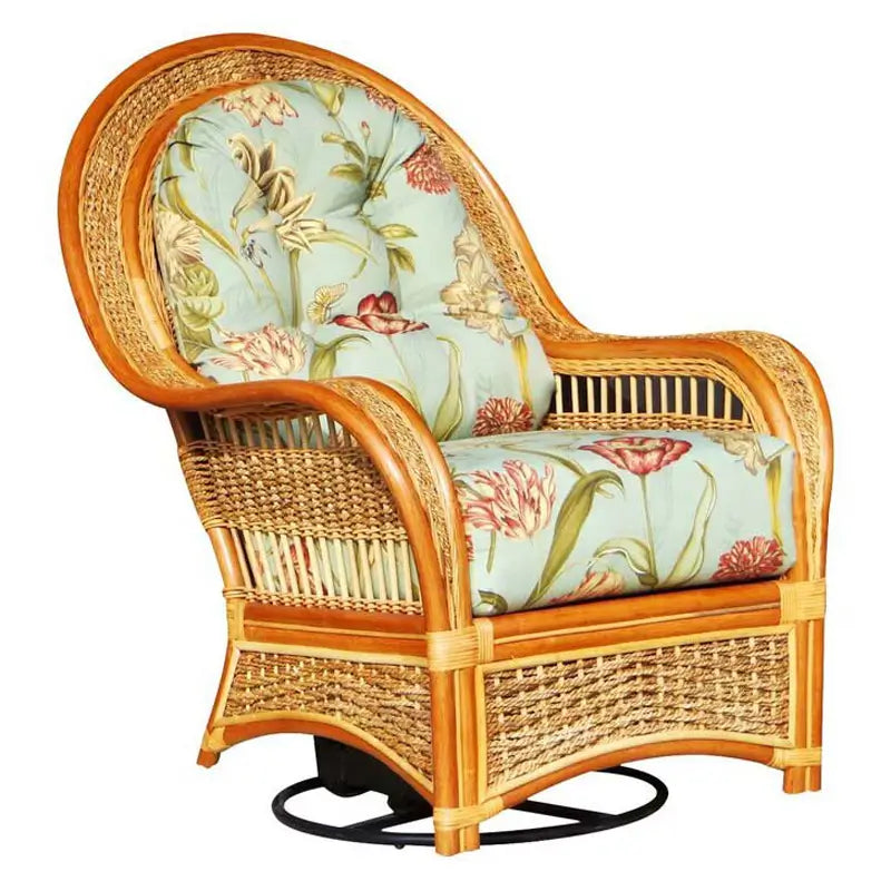 Spice Island swivel rocker in natural rattan with aqua floral cushions and a black swivel base on white