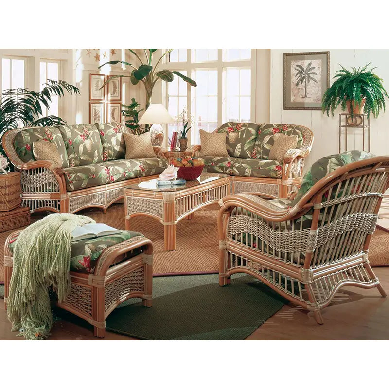 Natural Seascape wicker sofa with green tropical cushions in a sunroom beside the matching loveseat and arm chair