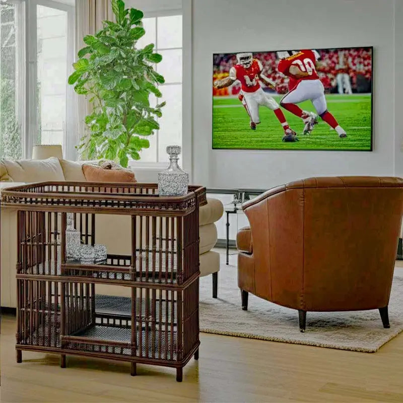 Williamsburg Counter Height Table in coffee finish styled in a living room with a leather armchair and TV console