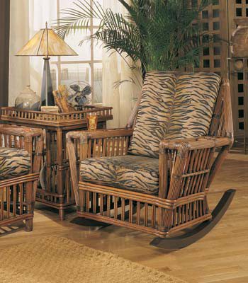 Williamsburg Rocker with tiger stripe cushions beside an end table holding a lamp and books